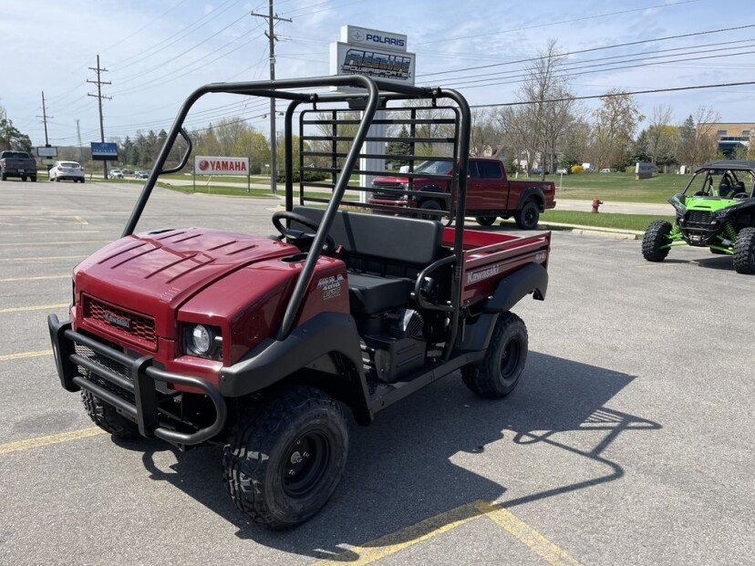 2023 Kawasaki Mule™ 4010 4×4 MEET THE NO-NONSENSE, MID-SIZE POWERHOUSE You dont quit during a hard days work, and neither does the Kawasaki MULE™ 4000 and MULE™ 4010 4×4 side x sides. These mid-size, high capacity, two-passenger vehicles have the muscle and endurance for a full days work, plus the towing and cargo capacity to take the heavy load off your shoulders. Features include: POWER GET THE JOB DONE MULE™ 4000 and MULE™ 4010 side x sides deliver muscle with a dependable, fuel-injected 617cc V-twin engine. The smooth-running liquid-cooled four-stroke starts easily whether it’s hot or cold and provides steady torque for smooth, responsive power when you need it. DRIVETRAIN KEEP UP THE POWER Automatic Continuously Variable Transmission (CVT) puts the power to the ground. MULE™ 4010 side x sides are available in 2WD or selectable 4WD and feature a dual-mode rear differential for added traction when needed. CHASSIS STRONG FOUNDATION Steel tube ladder-type frame is the sturdy foundation of Kawasaki MULE™ side x sides. Optimized rigidity contributes to traction, stability and ride comfort while the Roll Over Protective Structure (ROPS) and steel front bumper provide a rugged external structure. CAPABILITY TAKE A LOAD OFF Independent MacPherson strut-type front suspension and DeDion rear suspension provide a firm and predictable platform that is ideal for a work-oriented side x side. Tow up to 1,200 lbs. and carry up to 800 lbs. in the cargo bed. Electric Power Steering (EPS)